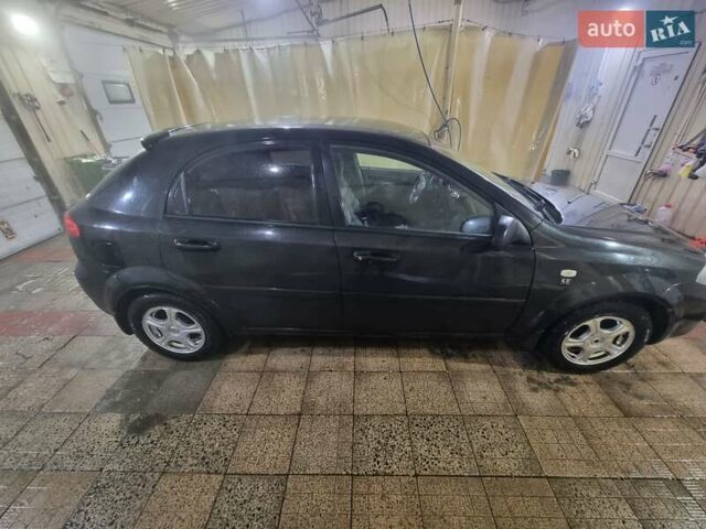 Черный Шевроле Лачетти, объемом двигателя 1.6 л и пробегом 229 тыс. км за 4200 $, фото 16 на Automoto.ua