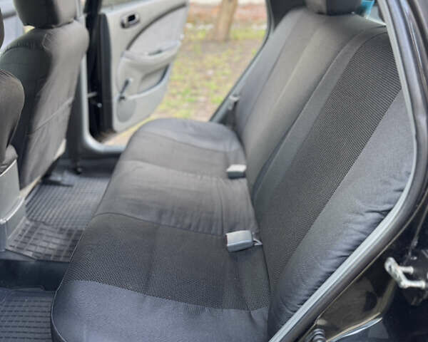 Черный Шевроле Лачетти, объемом двигателя 1.6 л и пробегом 209 тыс. км за 3850 $, фото 16 на Automoto.ua