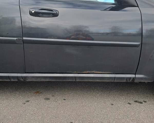 Черный Шевроле Лачетти, объемом двигателя 1.8 л и пробегом 200 тыс. км за 3300 $, фото 15 на Automoto.ua