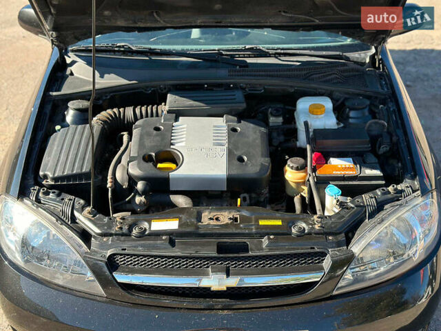 Черный Шевроле Лачетти, объемом двигателя 1.8 л и пробегом 146 тыс. км за 4990 $, фото 36 на Automoto.ua