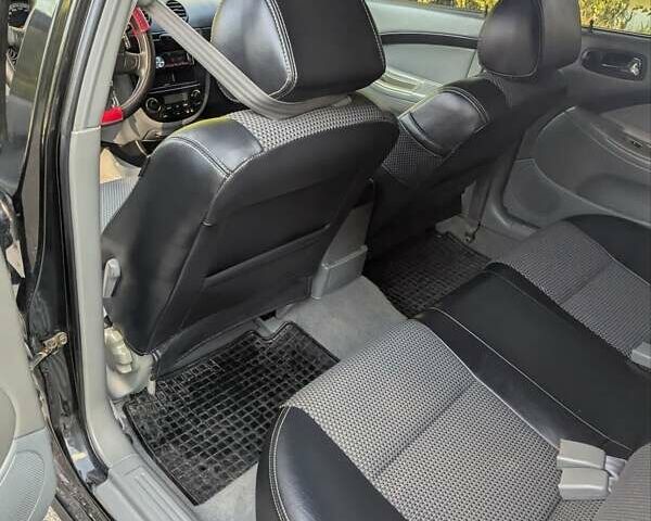 Черный Шевроле Лачетти, объемом двигателя 1.8 л и пробегом 134 тыс. км за 6450 $, фото 45 на Automoto.ua