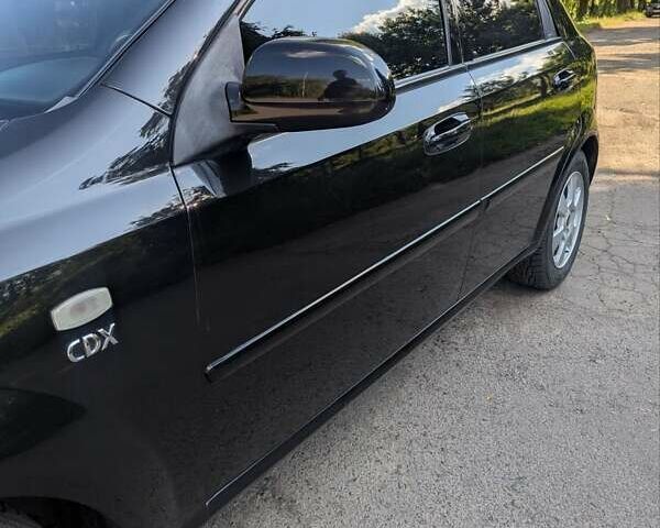 Черный Шевроле Лачетти, объемом двигателя 1.8 л и пробегом 134 тыс. км за 6450 $, фото 12 на Automoto.ua