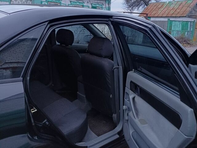 Черный Шевроле Лачетти, объемом двигателя 1.8 л и пробегом 241 тыс. км за 4300 $, фото 9 на Automoto.ua