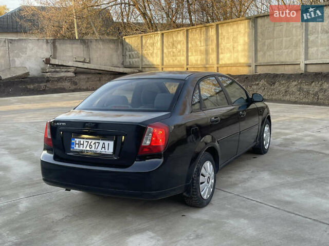 Черный Шевроле Лачетти, объемом двигателя 1.8 л и пробегом 180 тыс. км за 2850 $, фото 4 на Automoto.ua