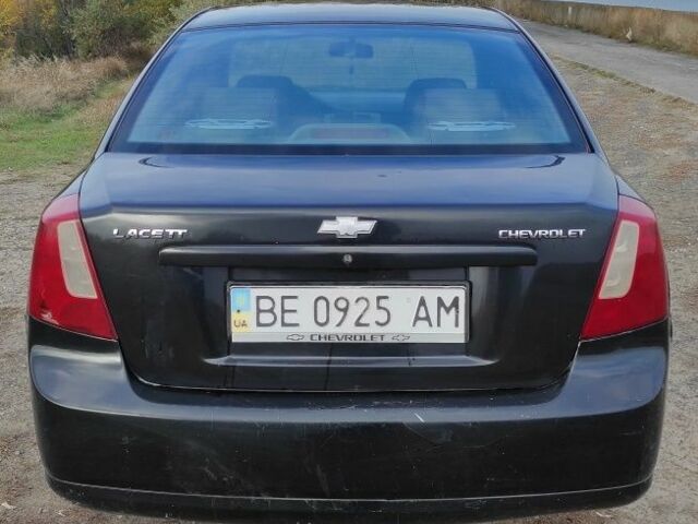 Черный Шевроле Лачетти, объемом двигателя 1.8 л и пробегом 300 тыс. км за 2850 $, фото 2 на Automoto.ua