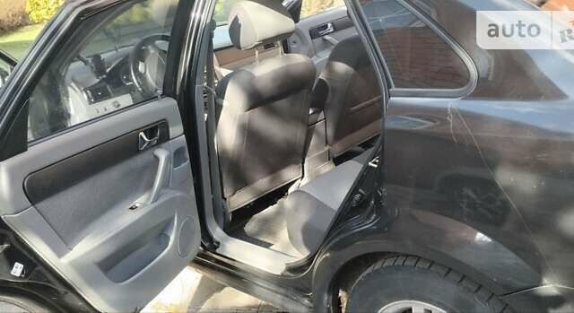 Черный Шевроле Лачетти, объемом двигателя 1.8 л и пробегом 237 тыс. км за 3850 $, фото 12 на Automoto.ua