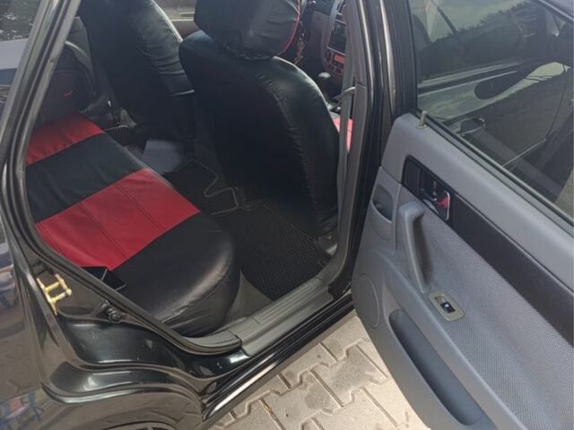 Черный Шевроле Лачетти, объемом двигателя 1.8 л и пробегом 185 тыс. км за 3700 $, фото 2 на Automoto.ua