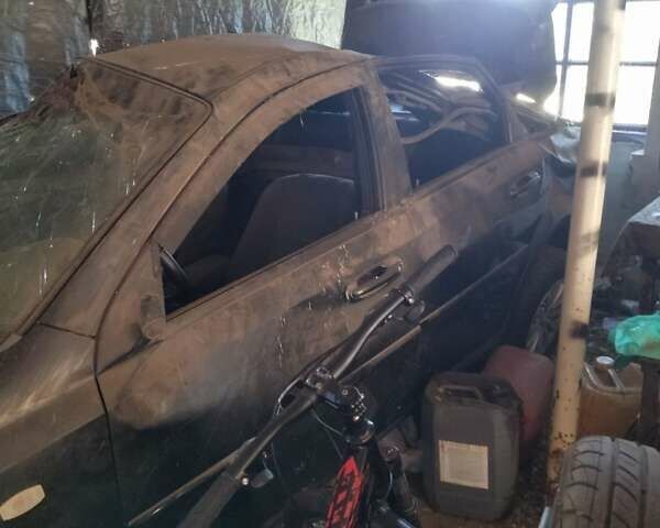 Черный Шевроле Лачетти, объемом двигателя 1.6 л и пробегом 200 тыс. км за 2000 $, фото 2 на Automoto.ua