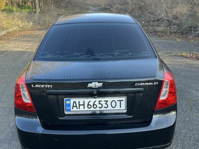 Черный Шевроле Лачетти, объемом двигателя 1.6 л и пробегом 150 тыс. км за 5300 $, фото 4 на Automoto.ua