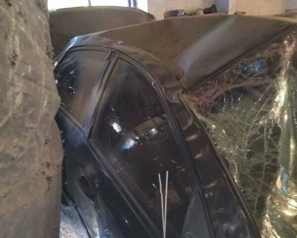 Черный Шевроле Лачетти, объемом двигателя 1.6 л и пробегом 200 тыс. км за 2000 $, фото 1 на Automoto.ua