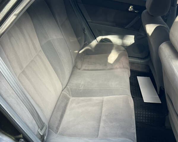 Черный Шевроле Лачетти, объемом двигателя 1.8 л и пробегом 248 тыс. км за 4250 $, фото 18 на Automoto.ua