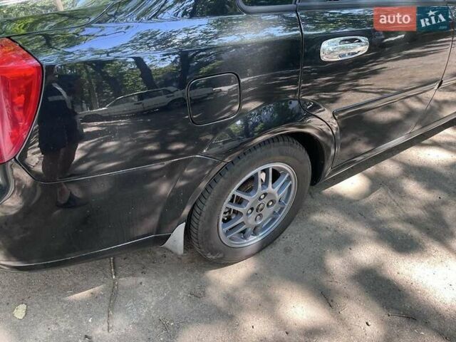 Черный Шевроле Лачетти, объемом двигателя 1.8 л и пробегом 243 тыс. км за 4900 $, фото 2 на Automoto.ua