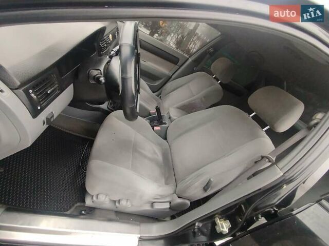 Черный Шевроле Лачетти, объемом двигателя 1.8 л и пробегом 205 тыс. км за 4000 $, фото 41 на Automoto.ua