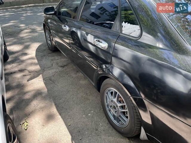 Черный Шевроле Лачетти, объемом двигателя 1.8 л и пробегом 243 тыс. км за 4900 $, фото 5 на Automoto.ua