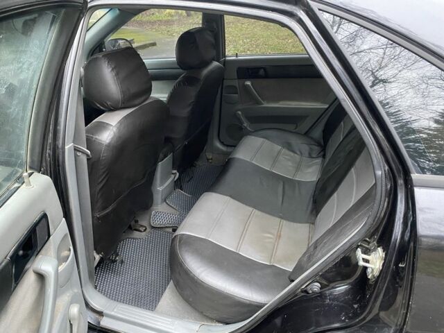 Черный Шевроле Лачетти, объемом двигателя 1.6 л и пробегом 264 тыс. км за 1999 $, фото 12 на Automoto.ua