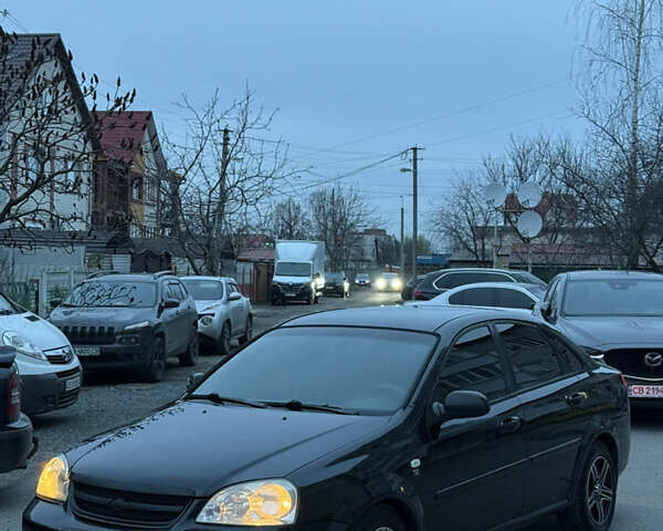 Черный Шевроле Лачетти, объемом двигателя 1.6 л и пробегом 233 тыс. км за 3750 $, фото 29 на Automoto.ua