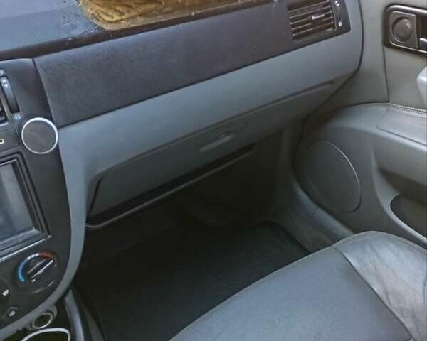 Черный Шевроле Лачетти, объемом двигателя 1.8 л и пробегом 282 тыс. км за 3500 $, фото 11 на Automoto.ua