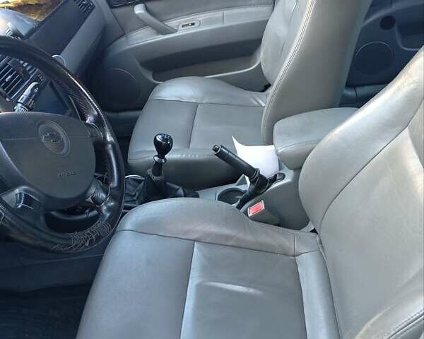 Черный Шевроле Лачетти, объемом двигателя 1.8 л и пробегом 282 тыс. км за 3500 $, фото 12 на Automoto.ua