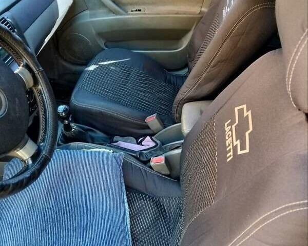 Черный Шевроле Лачетти, объемом двигателя 1.8 л и пробегом 290 тыс. км за 3700 $, фото 3 на Automoto.ua