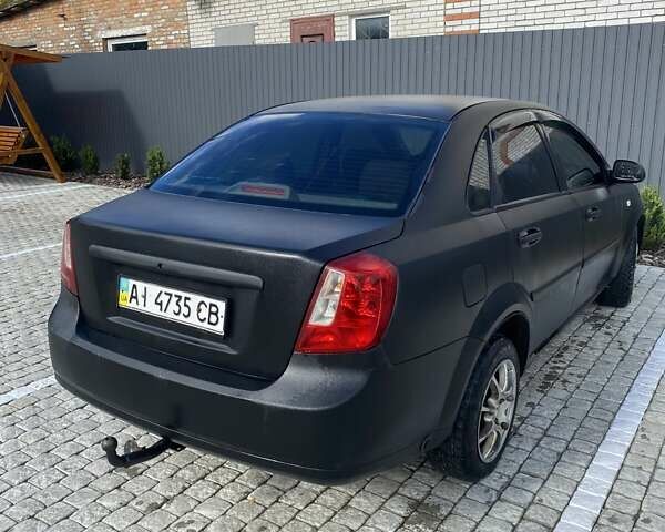 Черный Шевроле Лачетти, объемом двигателя 1.6 л и пробегом 302 тыс. км за 3900 $, фото 4 на Automoto.ua