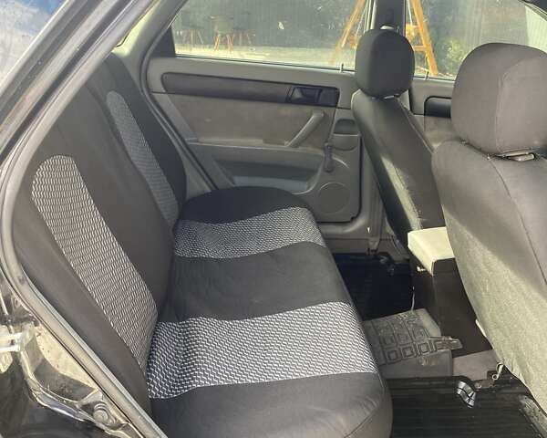 Черный Шевроле Лачетти, объемом двигателя 1.6 л и пробегом 302 тыс. км за 3900 $, фото 3 на Automoto.ua