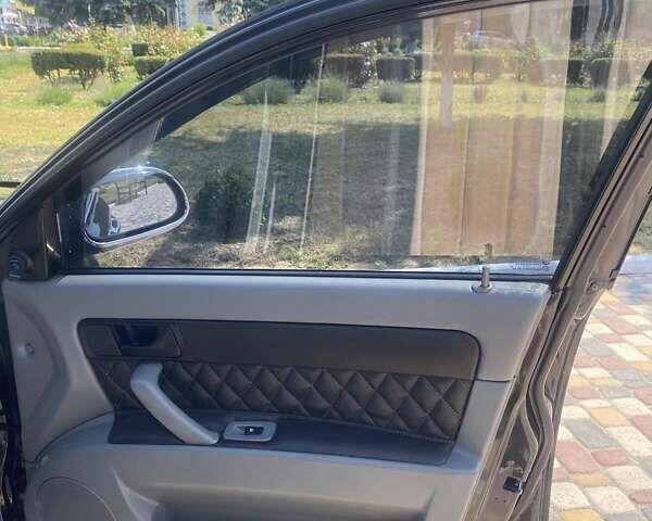 Черный Шевроле Лачетти, объемом двигателя 1.6 л и пробегом 156 тыс. км за 6100 $, фото 12 на Automoto.ua