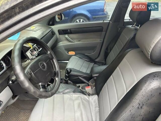 Черный Шевроле Лачетти, объемом двигателя 1.6 л и пробегом 230 тыс. км за 3900 $, фото 3 на Automoto.ua