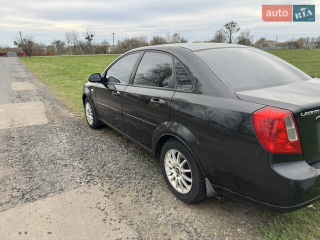 Черный Шевроле Лачетти, объемом двигателя 1.6 л и пробегом 153 тыс. км за 5000 $, фото 2 на Automoto.ua