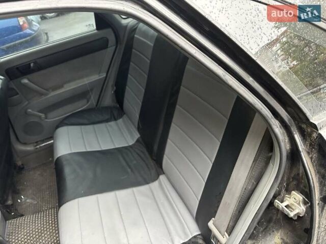 Черный Шевроле Лачетти, объемом двигателя 1.6 л и пробегом 230 тыс. км за 3900 $, фото 2 на Automoto.ua