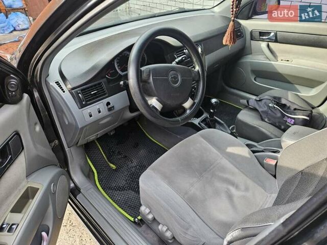 Чорний Шевроле Лачетті, об'ємом двигуна 1.8 л та пробігом 215 тис. км за 4600 $, фото 3 на Automoto.ua