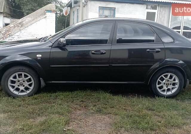 Чорний Шевроле Лачетті, об'ємом двигуна 1.8 л та пробігом 215 тис. км за 5200 $, фото 6 на Automoto.ua