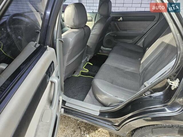 Чорний Шевроле Лачетті, об'ємом двигуна 1.8 л та пробігом 215 тис. км за 4600 $, фото 2 на Automoto.ua