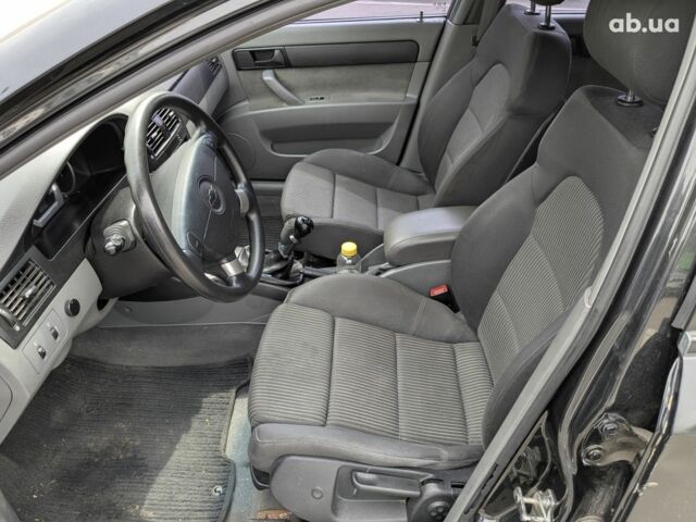 Черный Шевроле Лачетти, объемом двигателя 1.6 л и пробегом 221 тыс. км за 5900 $, фото 5 на Automoto.ua