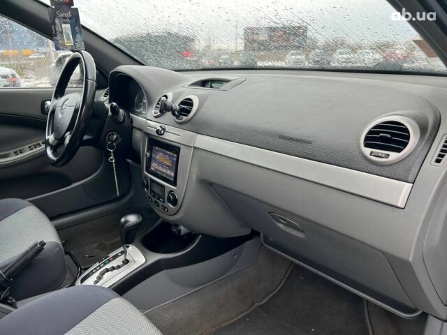 Черный Шевроле Лачетти, объемом двигателя 1.8 л и пробегом 293 тыс. км за 4190 $, фото 36 на Automoto.ua