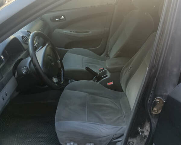 Черный Шевроле Лачетти, объемом двигателя 1.8 л и пробегом 425 тыс. км за 2700 $, фото 12 на Automoto.ua