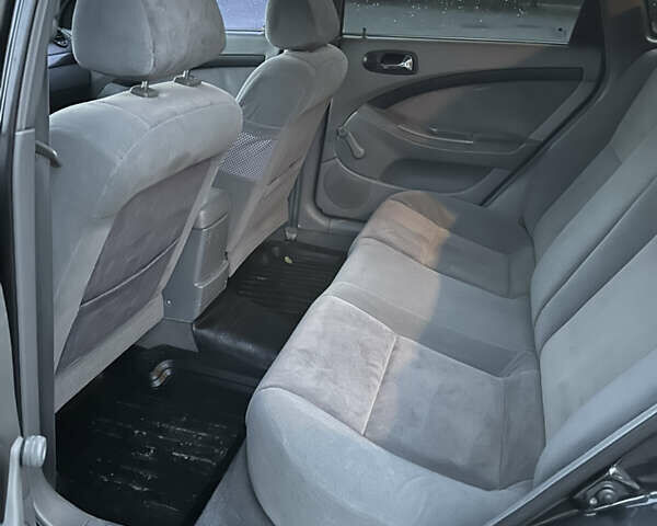 Черный Шевроле Лачетти, объемом двигателя 1.8 л и пробегом 180 тыс. км за 3900 $, фото 16 на Automoto.ua