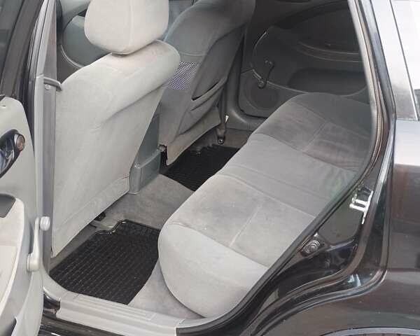 Чорний Шевроле Лачетті, об'ємом двигуна 1.8 л та пробігом 206 тис. км за 4100 $, фото 11 на Automoto.ua