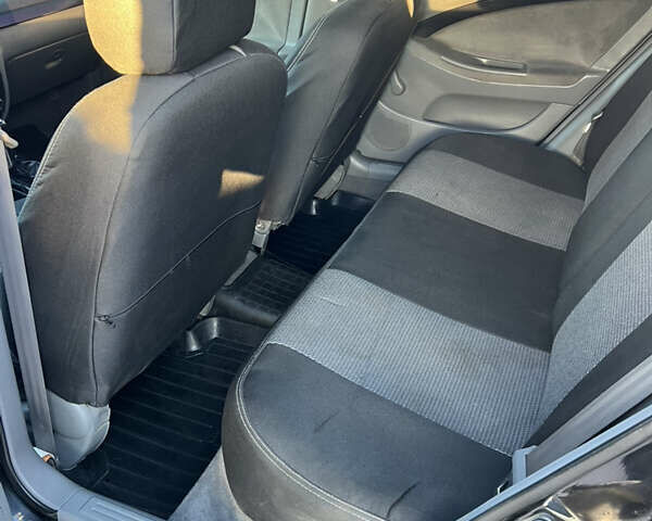 Черный Шевроле Лачетти, объемом двигателя 1.8 л и пробегом 210 тыс. км за 6150 $, фото 13 на Automoto.ua