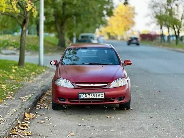 Красный Шевроле Лачетти, объемом двигателя 1.6 л и пробегом 300 тыс. км за 2350 $, фото 1 на Automoto.ua