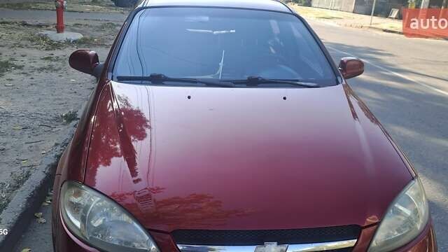 Красный Шевроле Лачетти, объемом двигателя 1.8 л и пробегом 280 тыс. км за 5700 $, фото 1 на Automoto.ua