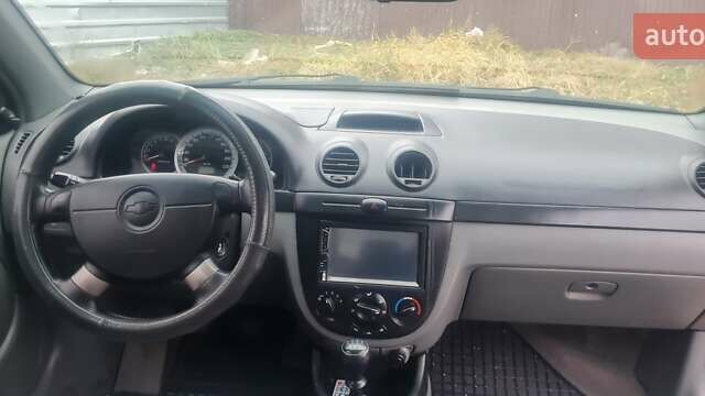 Красный Шевроле Лачетти, объемом двигателя 1.4 л и пробегом 259 тыс. км за 3500 $, фото 7 на Automoto.ua