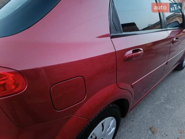 Красный Шевроле Лачетти, объемом двигателя 1.6 л и пробегом 261 тыс. км за 3650 $, фото 11 на Automoto.ua