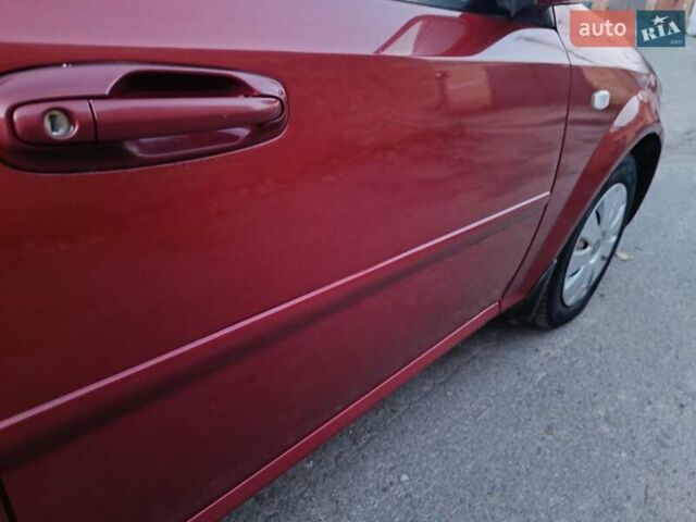 Красный Шевроле Лачетти, объемом двигателя 1.6 л и пробегом 261 тыс. км за 3650 $, фото 19 на Automoto.ua