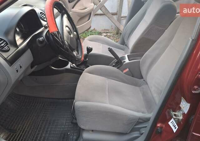 Красный Шевроле Лачетти, объемом двигателя 1.6 л и пробегом 141 тыс. км за 3399 $, фото 10 на Automoto.ua