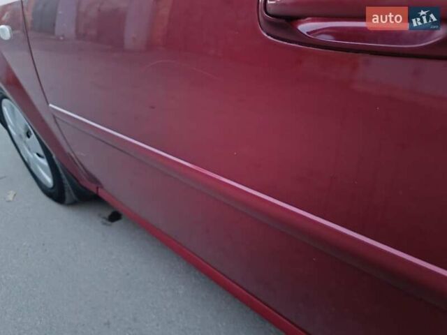 Красный Шевроле Лачетти, объемом двигателя 1.6 л и пробегом 261 тыс. км за 3650 $, фото 16 на Automoto.ua