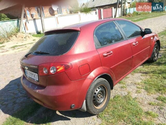 Красный Шевроле Лачетти, объемом двигателя 1.6 л и пробегом 303 тыс. км за 3300 $, фото 7 на Automoto.ua