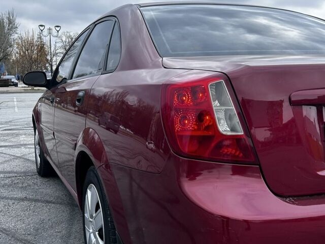 Красный Шевроле Лачетти, объемом двигателя 1.6 л и пробегом 222 тыс. км за 3999 $, фото 7 на Automoto.ua