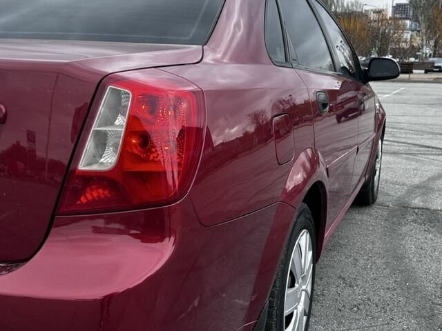 Красный Шевроле Лачетти, объемом двигателя 1.6 л и пробегом 222 тыс. км за 3999 $, фото 6 на Automoto.ua