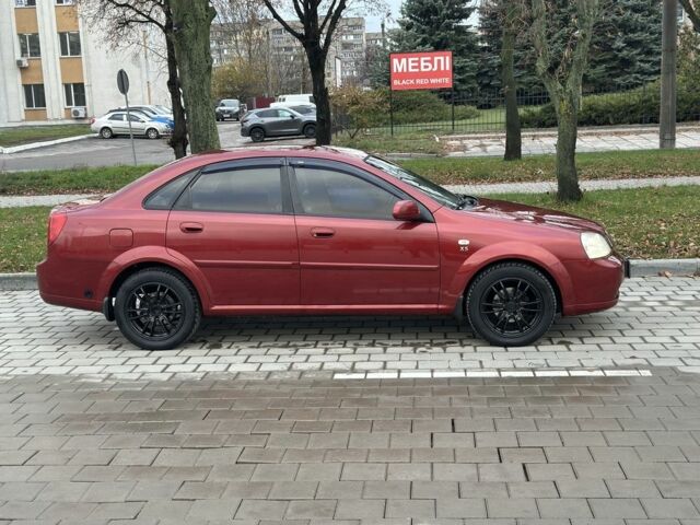 Красный Шевроле Лачетти, объемом двигателя 1.8 л и пробегом 230 тыс. км за 3550 $, фото 2 на Automoto.ua