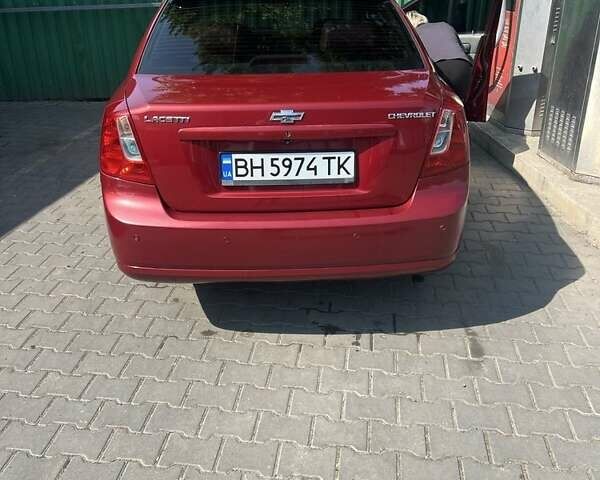 Красный Шевроле Лачетти, объемом двигателя 1.6 л и пробегом 370 тыс. км за 5000 $, фото 3 на Automoto.ua